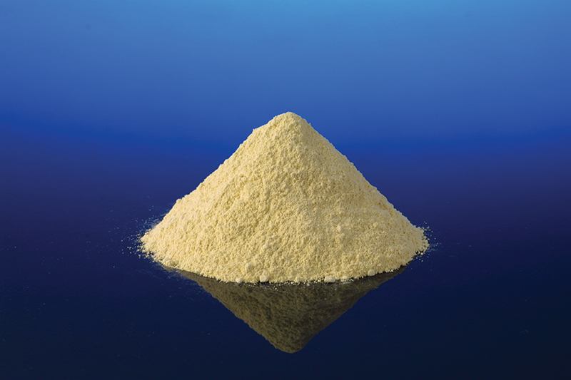 A small pile of PETI-330 resinous powder