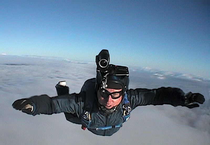 Skydiver wearing a video camera on his helmet