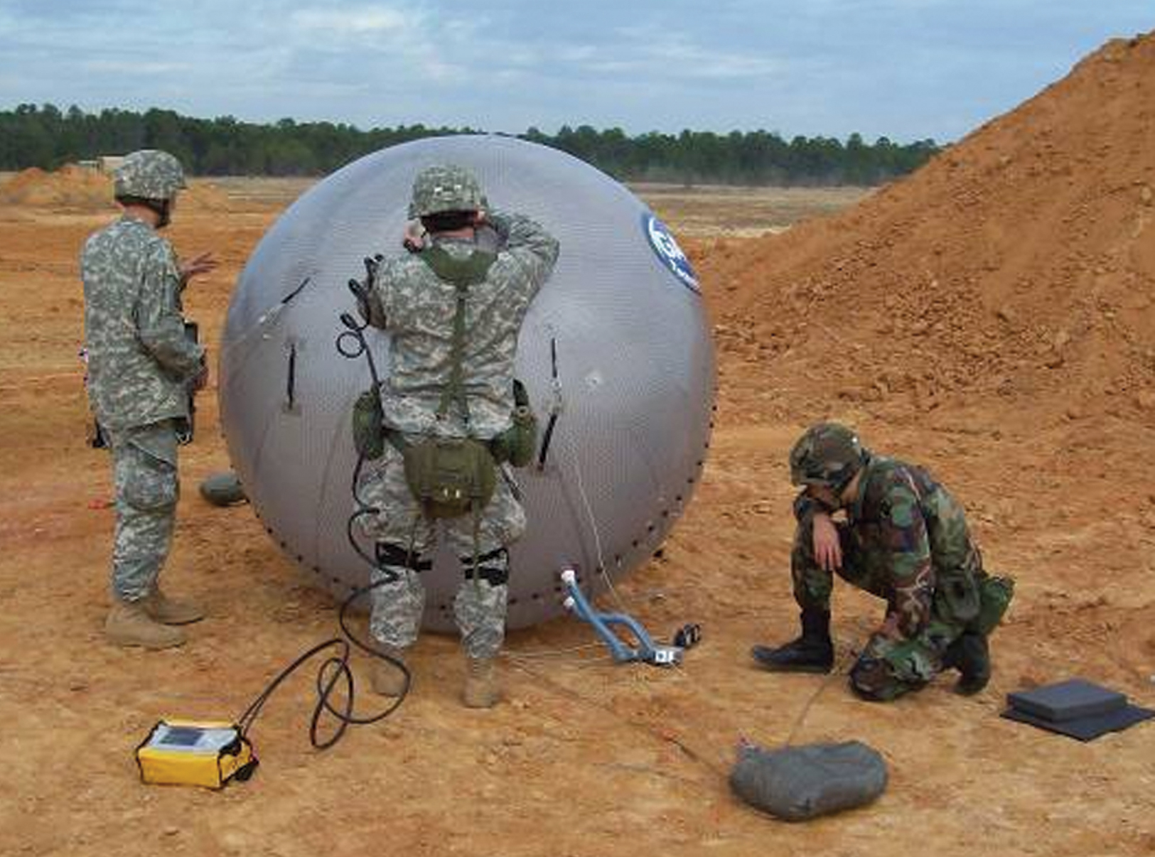 Soldiers deploy and test an inflatable antenna
