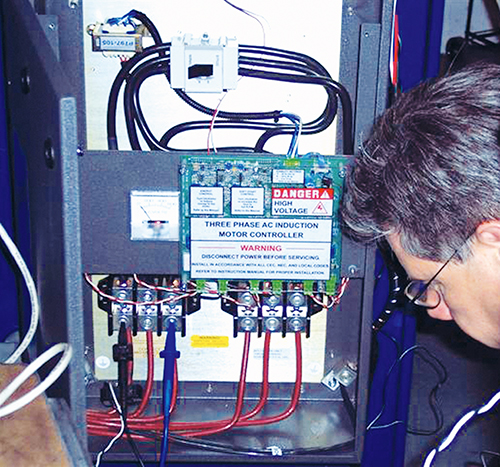 Man working with voltage controller