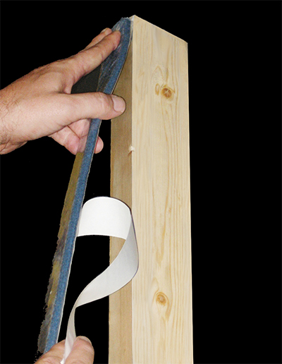 Thermablok strips are applied to wooden wall studs.