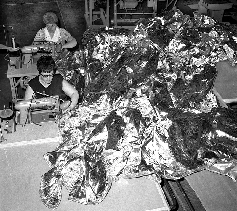 Seamstresses work on a sunshade for Skylab