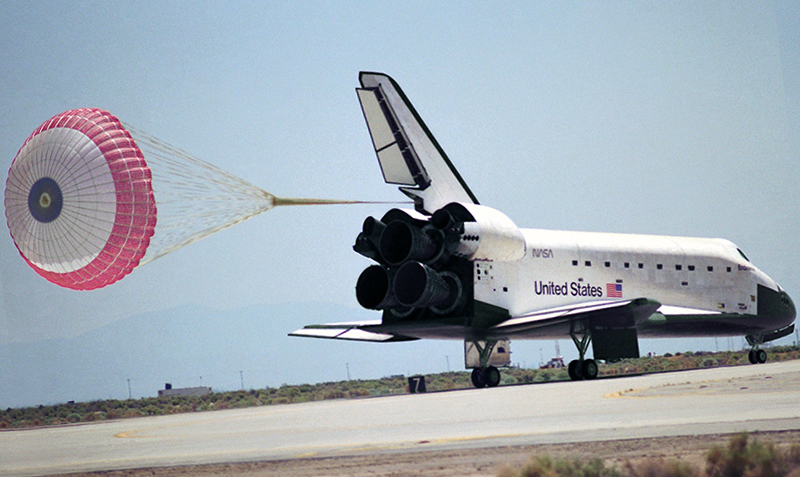 Space shuttle landing with drag parachute deployed