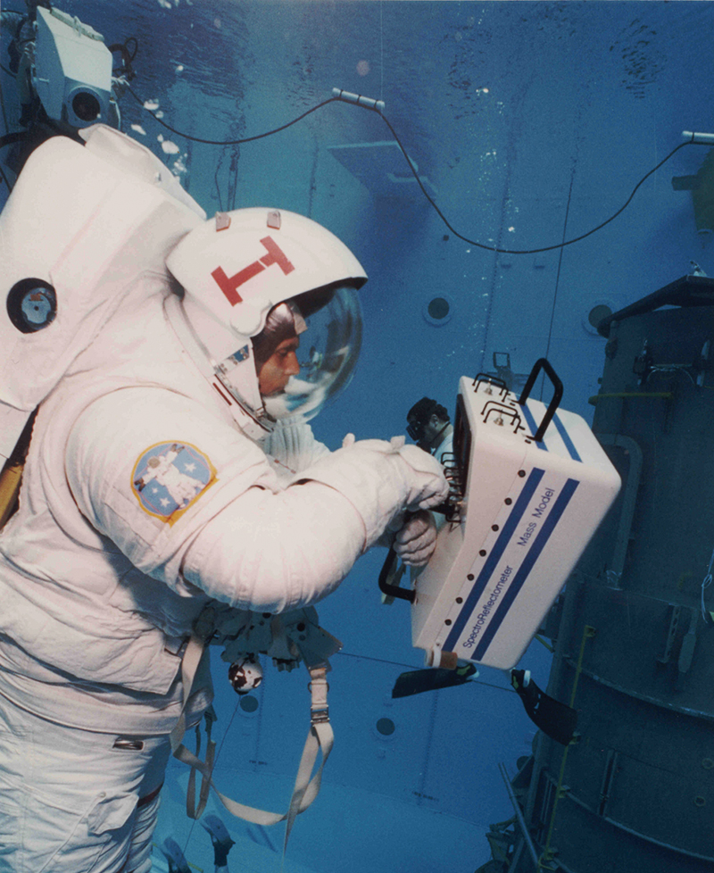 An astronaut tests the portable spectral reflectometer