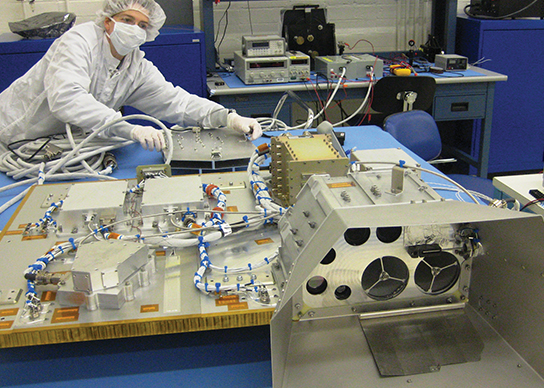 technician with science payload panel