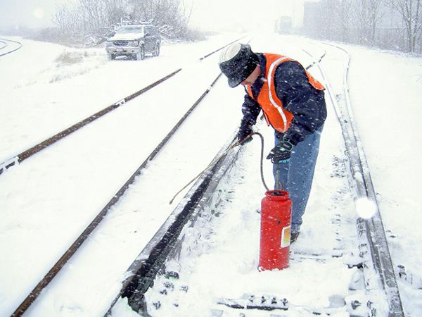 Train tracks being sprayed with Ice Free Switch