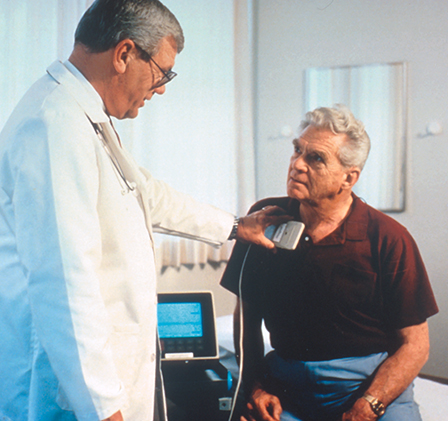 A physician checks a patient's advanced Trilogy pacemaker.