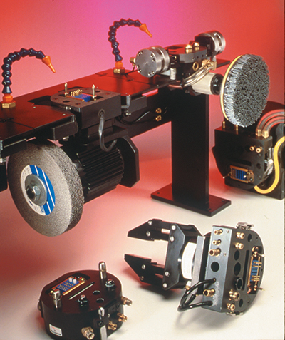 The tool rack of the Automatic Robotics Tool-change System includes a two-finger gripper, a grinder, a coated abrasive brush and a welding torch