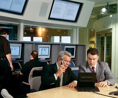 Ronn Bailey of Vanguard Integrity Professionals confers with a client during an attempted security breach. 