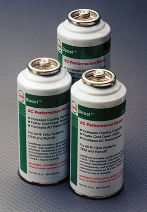 three cans of QuickBoost refrigerant additive