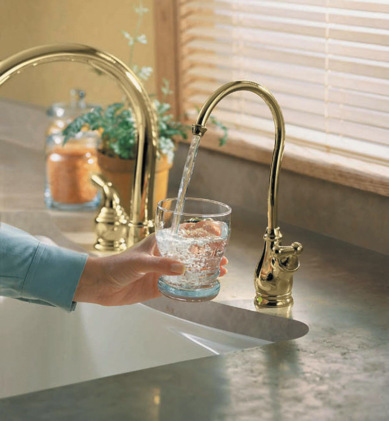 Moen’s PureTouch AquaSuite Filtered Water Dispenser, and Monticello Cathedral Spout Faucet in LifeShine Polished Brass