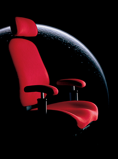 Red office chair with planet in background