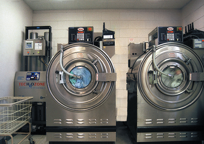 The ozone generator mounted beside laundry machines