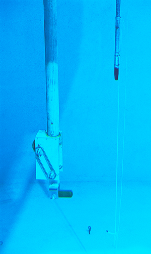 The pinger is dropped to 10 feet below the surface of the water