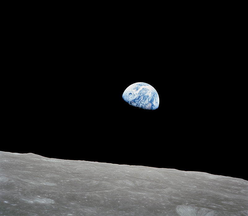 The first photo of Earth rising over the horizon of the moon