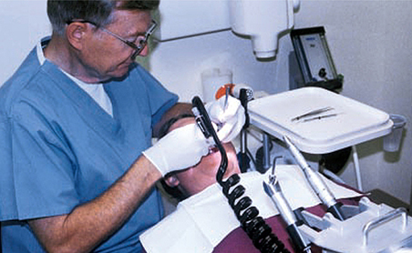 A dentist gives this patient the cleanest of water while dental tools do their work