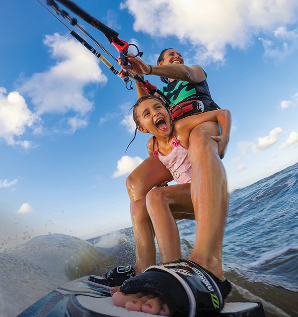 Mother and daughter surfing