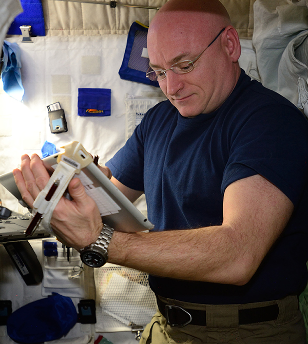 NASA astronaut Scott Kelly using an Apple iPad