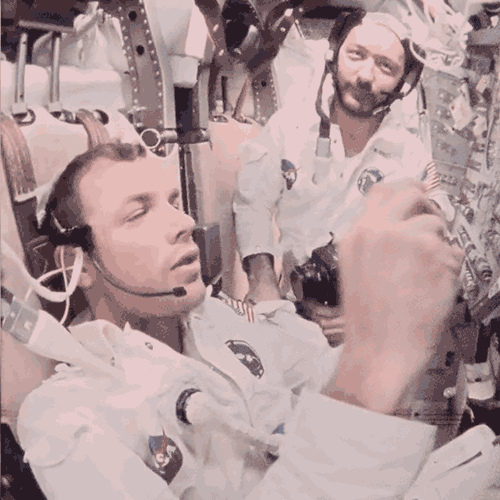 Apollo astronauts eating onboard spacecraft