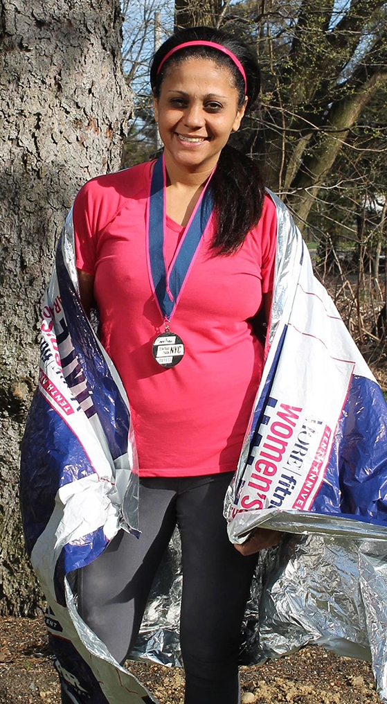 13-One founder Hema Nambiar sports a “space blanket” after finishing a half-marathon in 2011