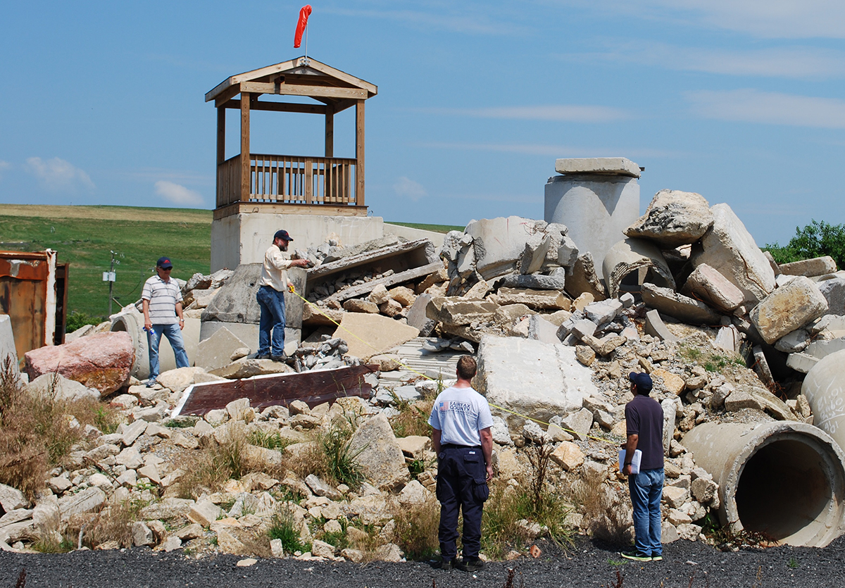 Several NASA engineers, including Jim Lux (second from the left), worked alongside DHS at the Virginia Task Force 1 Training Facility in Lorton, Virginia to test how far the device could see into rubble