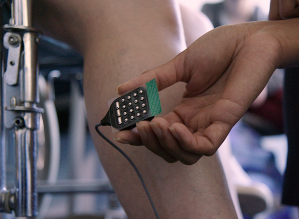 The Delsys Trigno Maize sensor held in a hand to show scale