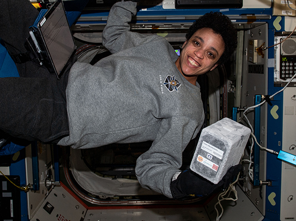 Astronaut Jessica Watkins holds a Nature’s Fynd bioreactor on the International Space Station