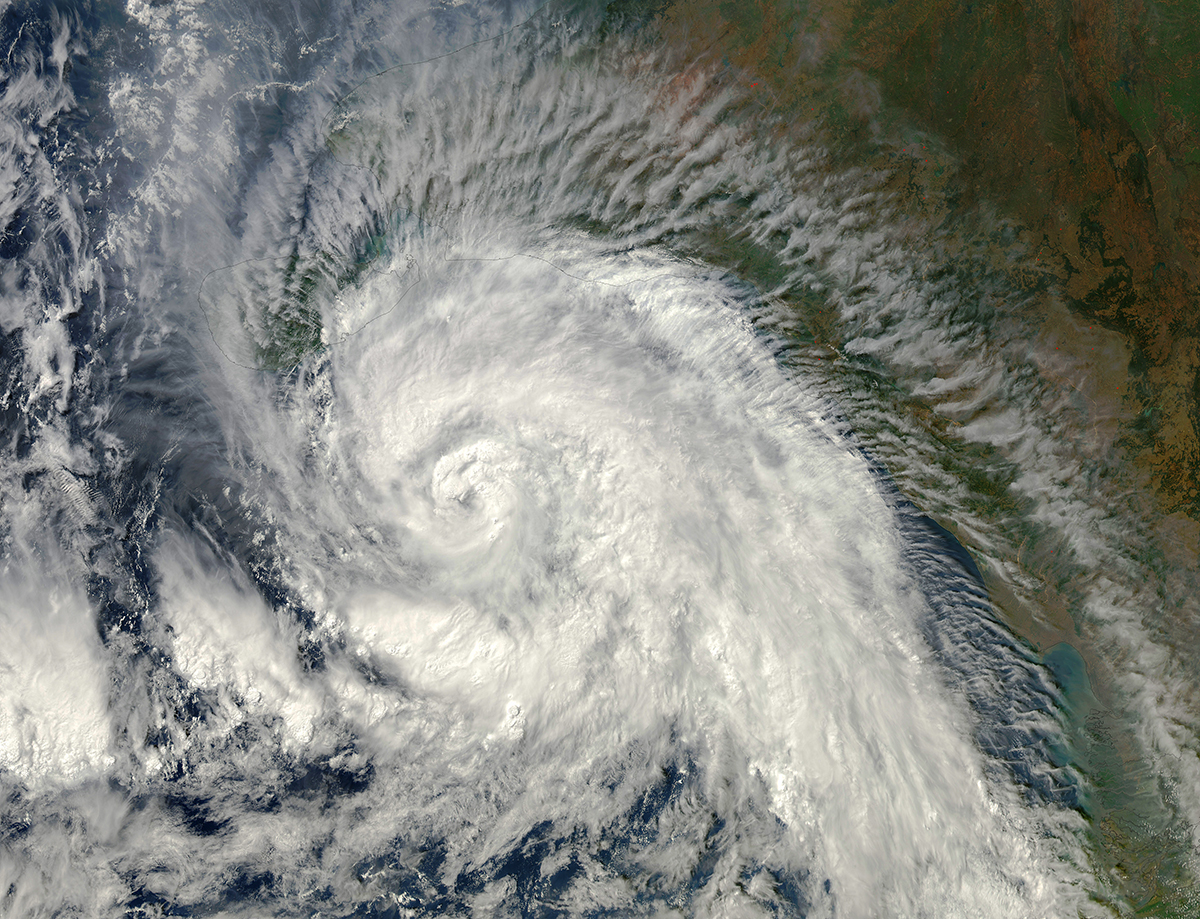 Tropical Cyclone Madi approaches India in 2013, as seen from the Moderate Resolution Imaging Spectroradiometer (MODIS) instrument aboard the Aqua spacecraft
