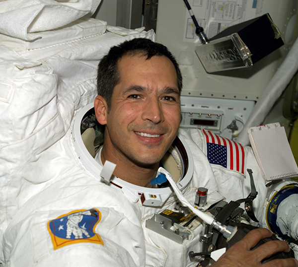 Astronaut John B. Herrington wears a spacesuit aboard the International Space Station in 2002