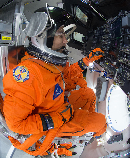 An astronaut during tests aboard the Orion spacecraft