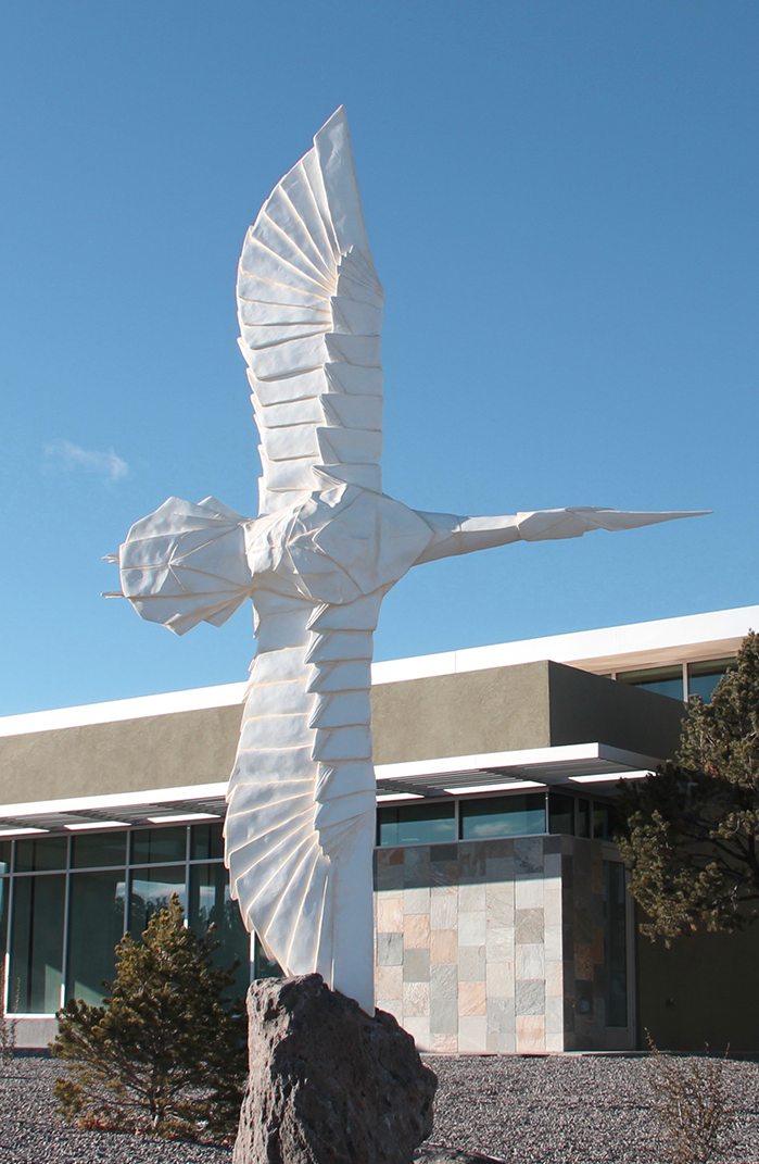 “Flying Peace,” a collaboration between origami artist Robert Lang and sculptor Kevin Box, stands outside White Rock Branch Library near Los Alamos, New Mexico