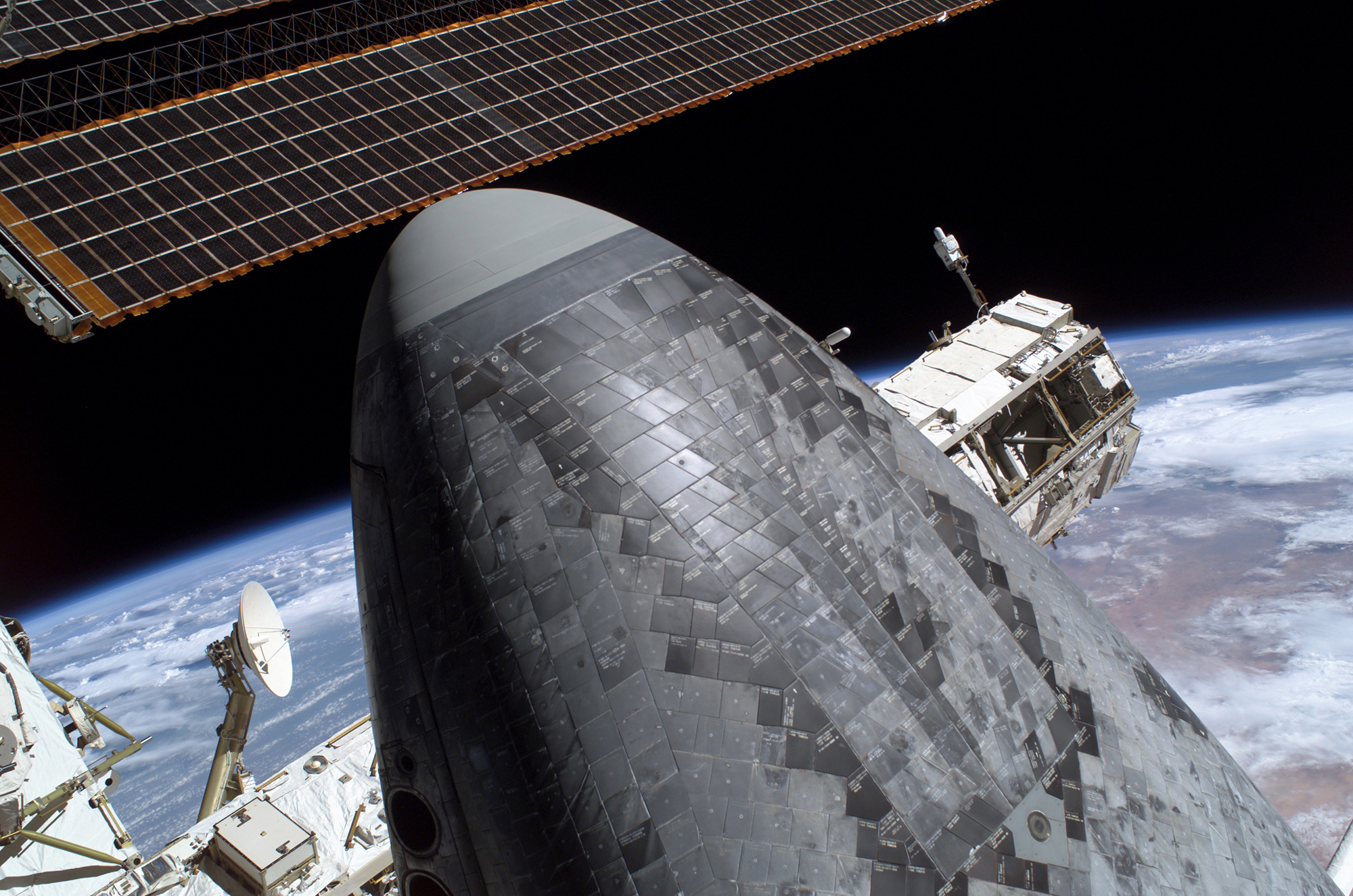 This picture of the underside of the space shuttle Discovery’s nosecone shows the thermal protection system tiles