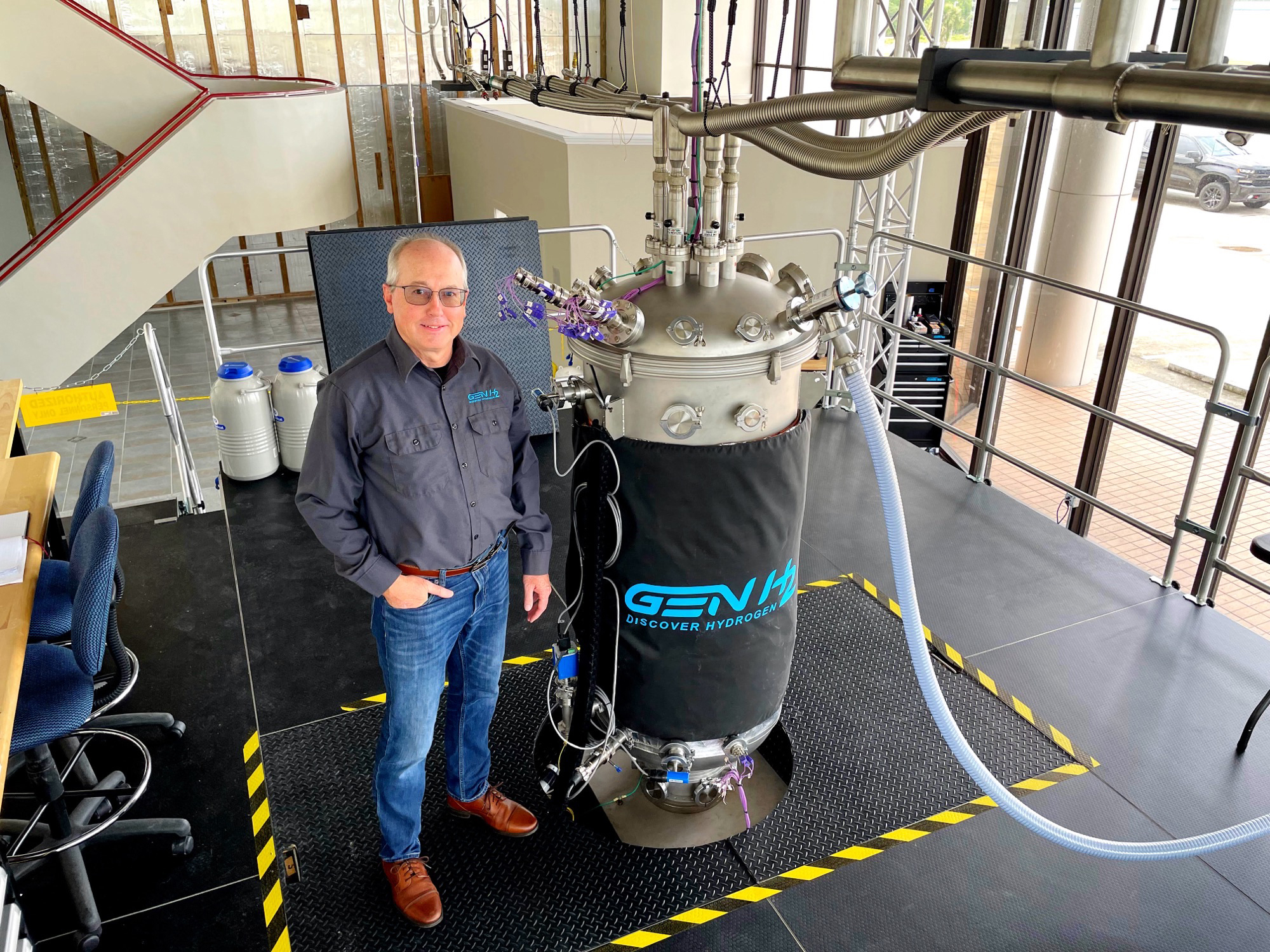 GenH2 cofounder James Fesmire stands next to the Cryostat CS900, the latest and most capable device in his series of cryostats