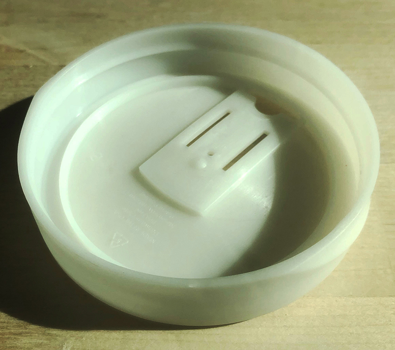 An aeropolymer beverage lid that is insulative and doesn’t let liquid cling to it