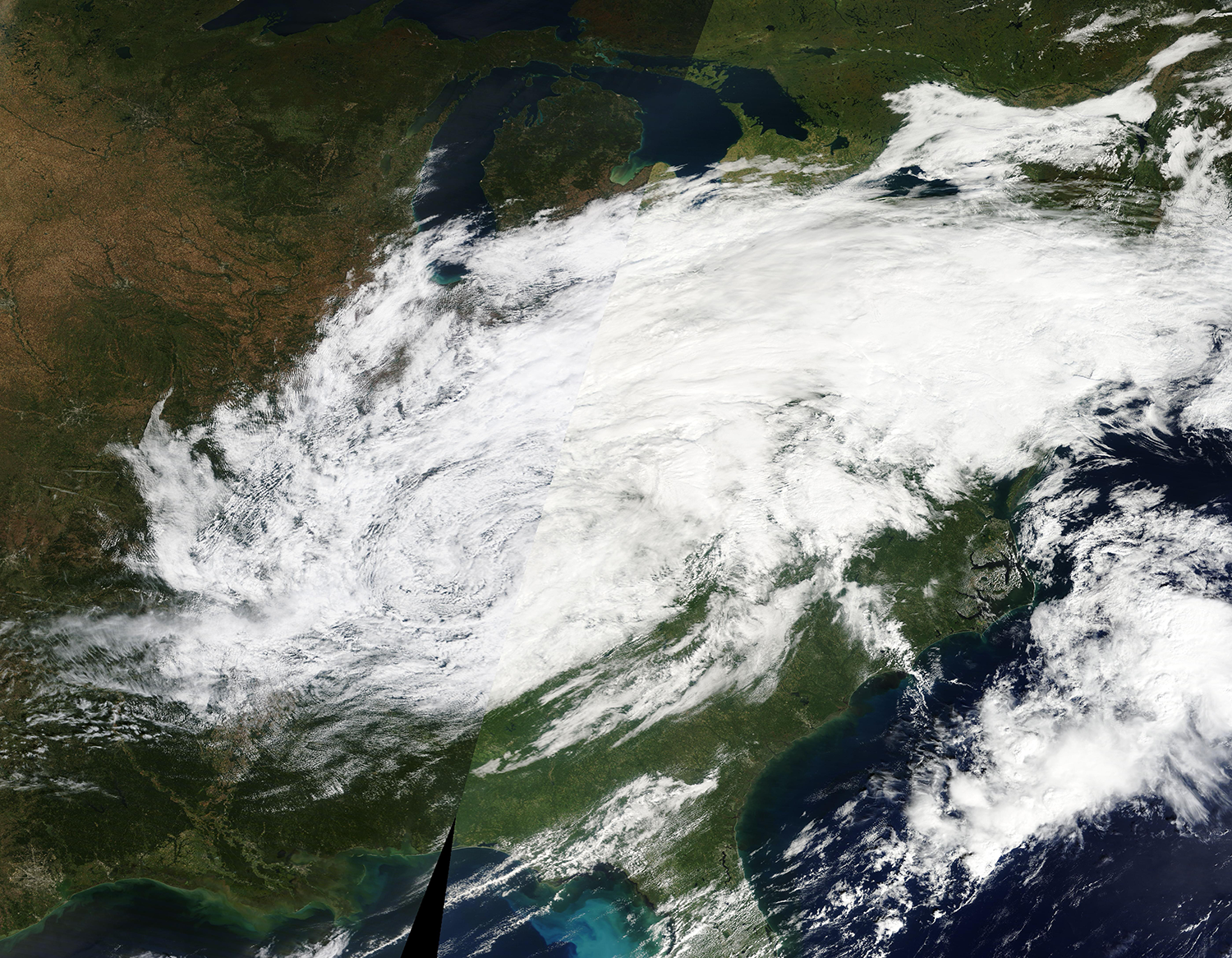 Satellite image of a hurricane swirling above North America 
