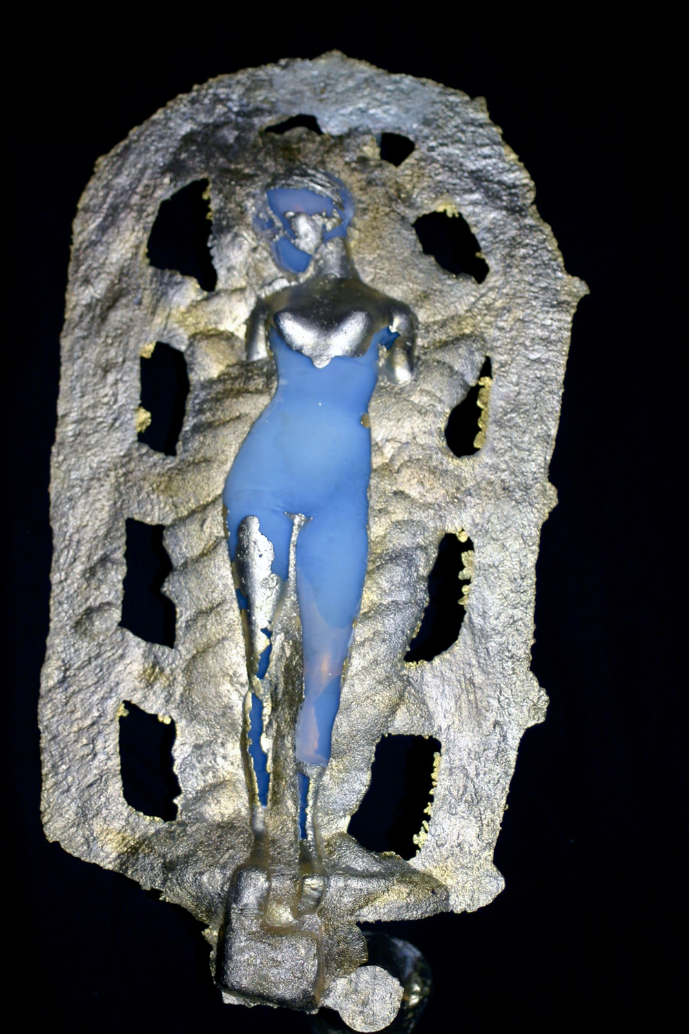 light blue female figure with portions of metallic overlay