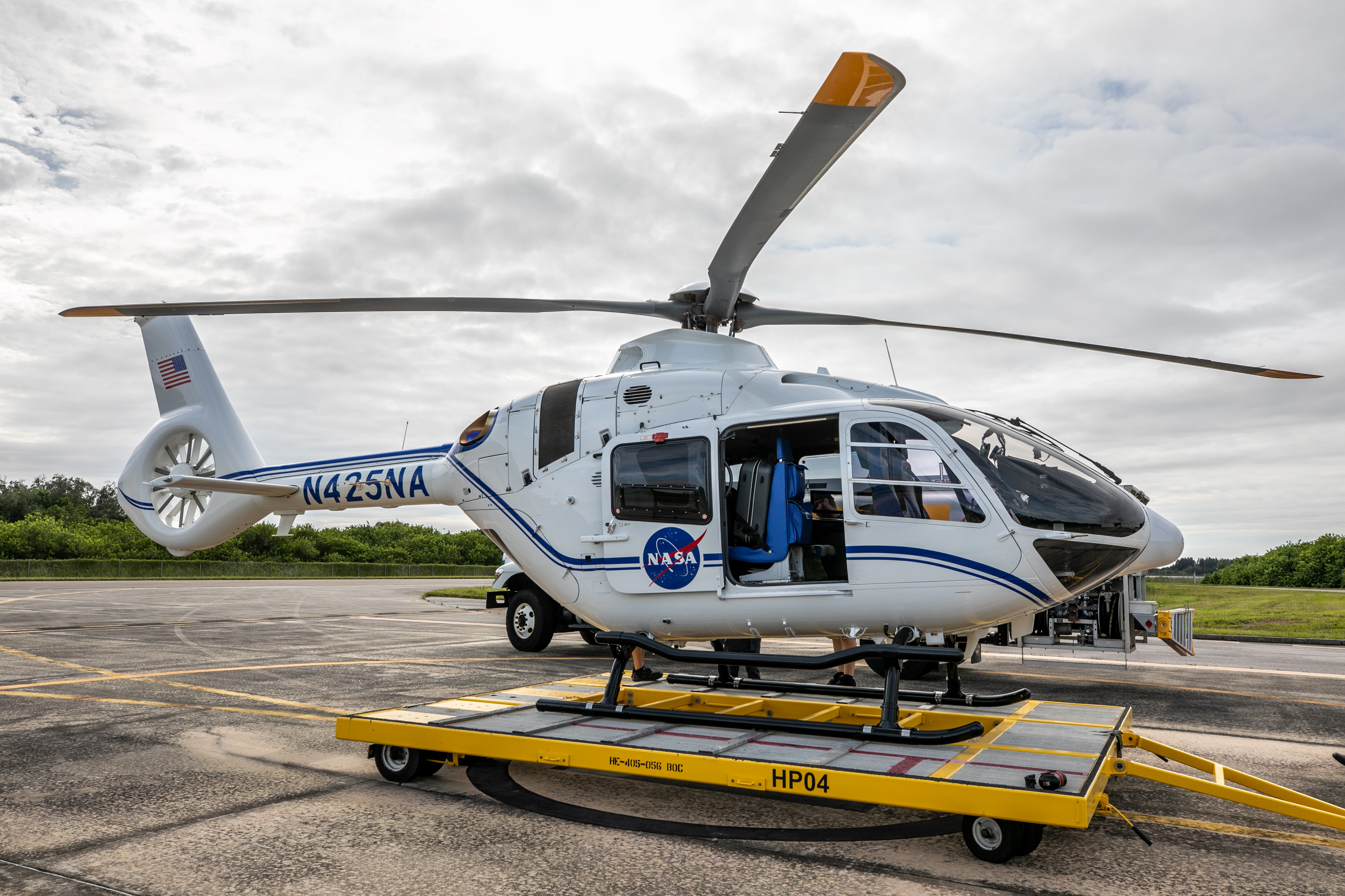 A helicopter with the NASA emblem on the side.