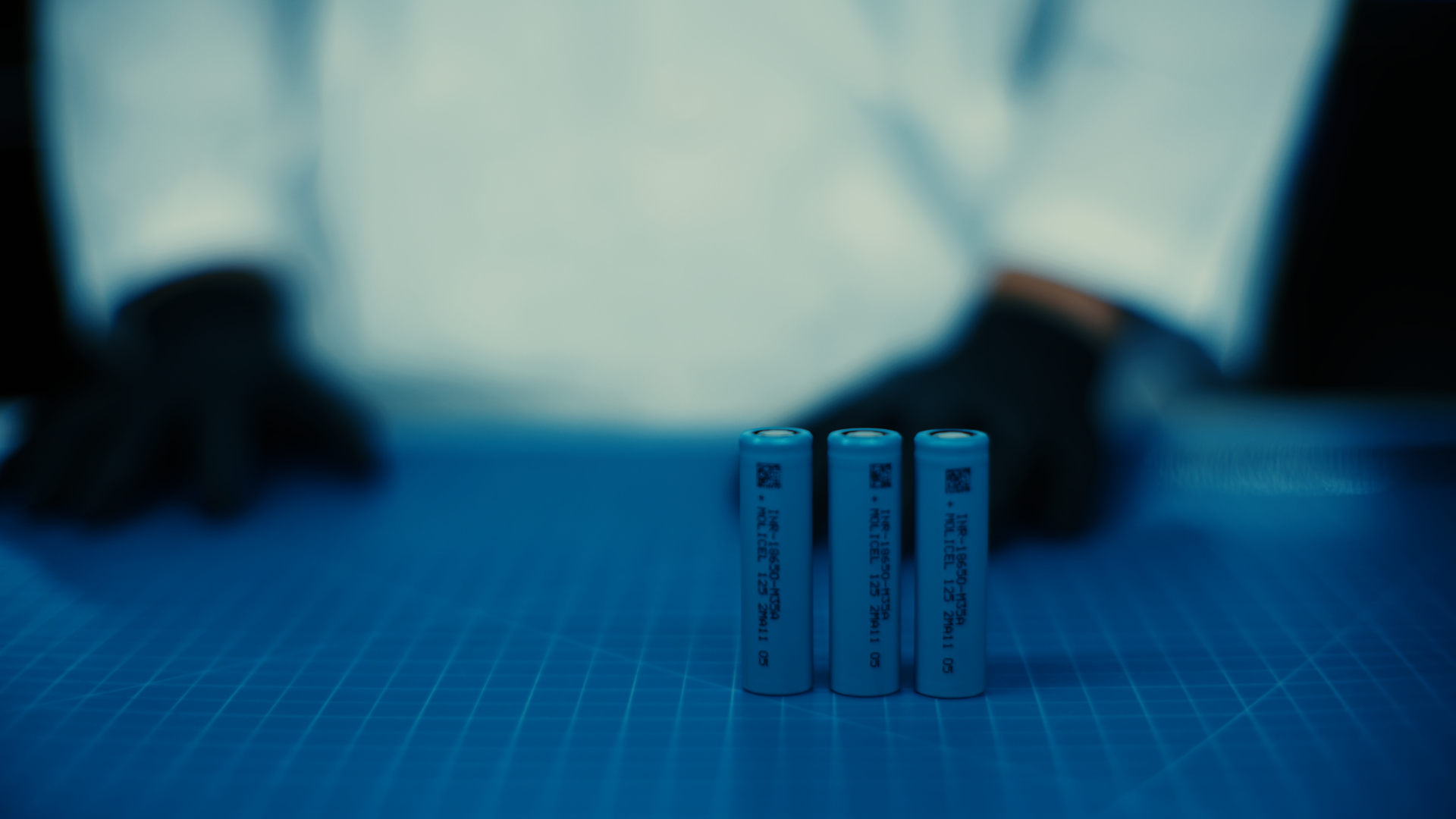 Three lithium-ion battery cells on a table