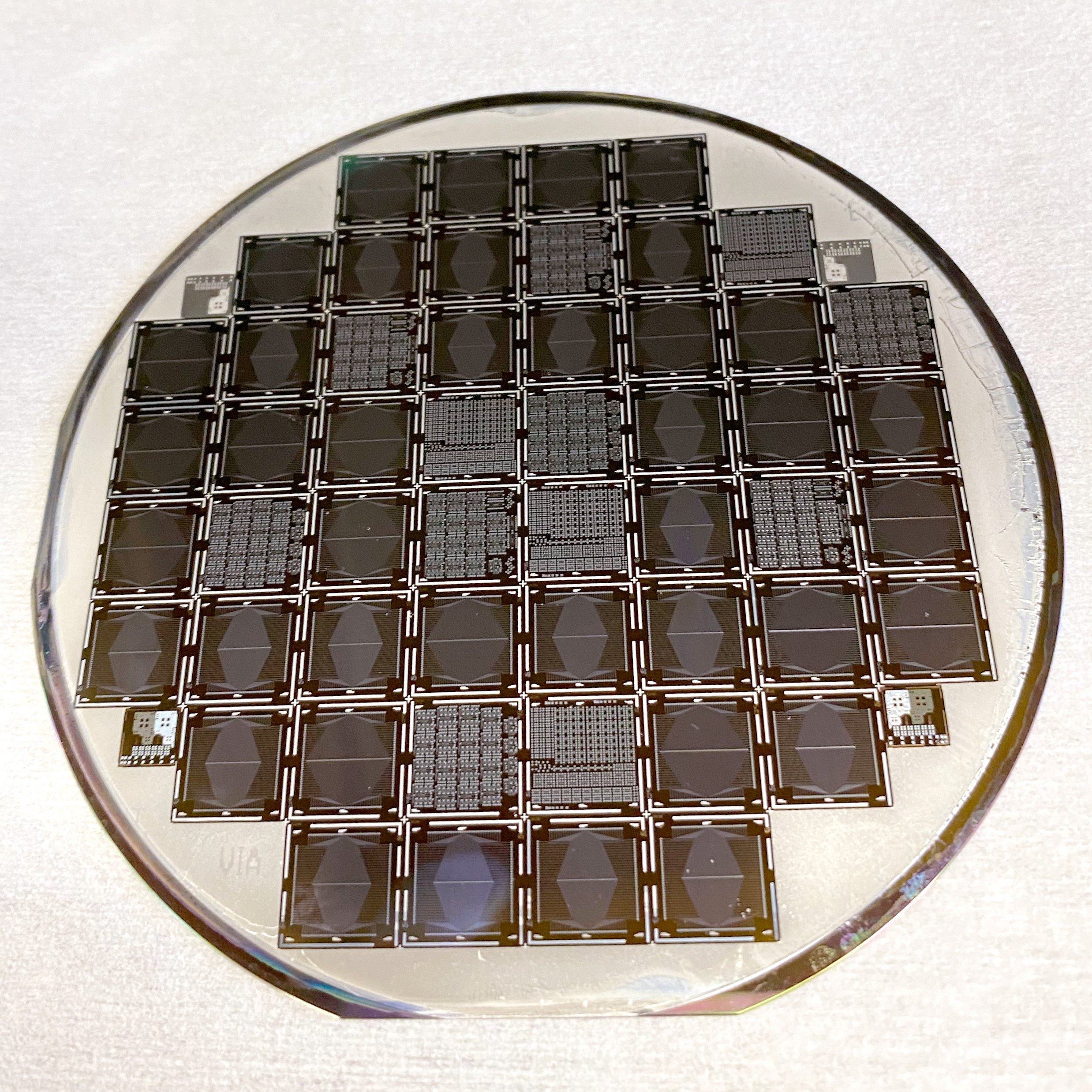 Inside a circle, a series of square photodiode chips are arranged in a plus-sign shape.