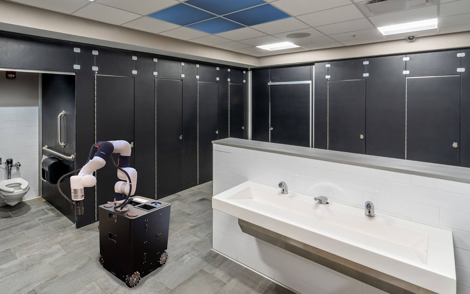 A robot on wheels with a robotic arm next to the sink in a spotless bathroom