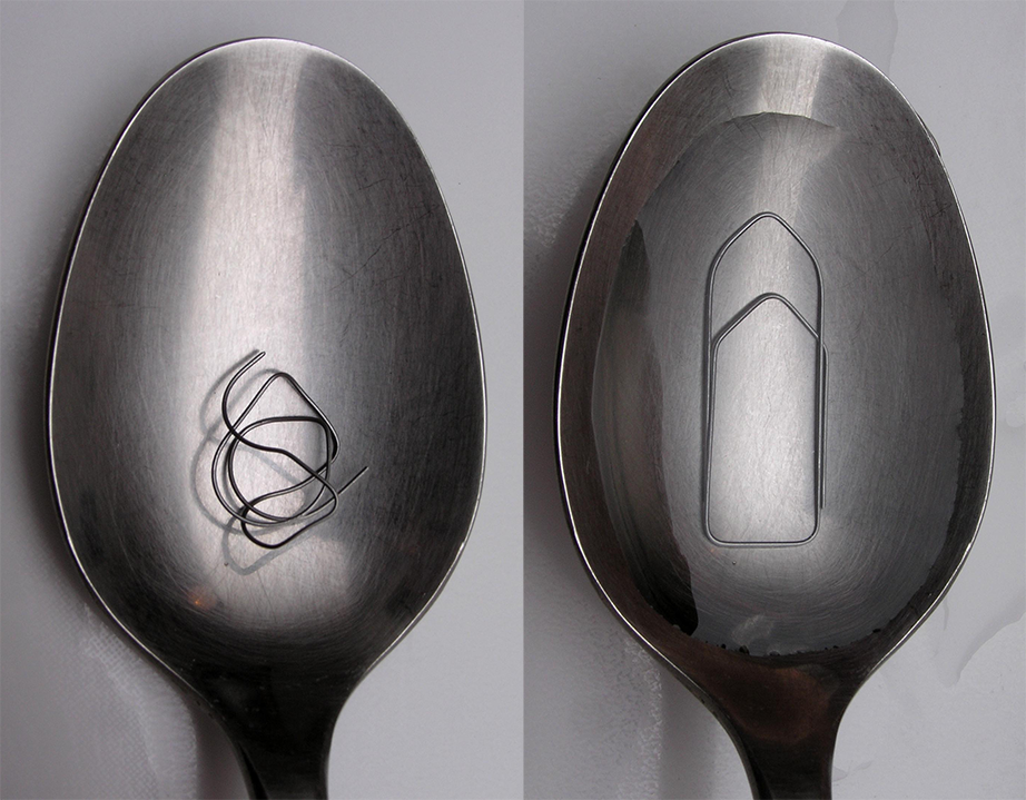 On the left, a spoon holding a piece of twisted wire rests on a neutral background. On the right, that same spoon is full of water, and submerged beneath the water’s surface is a paperclip