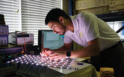 BiOS Lighting vice president Robert Soler works on an LED array in his lab