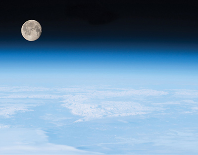 The Earth’s atmosphere with the moon rising