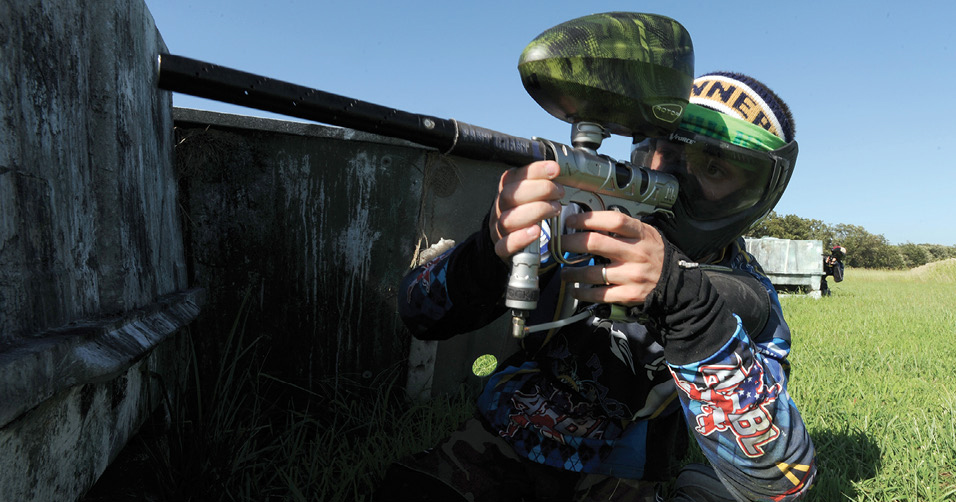 A paintballer takes aim