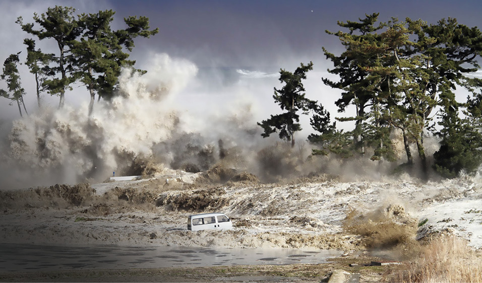 Water washes a van away while another tsunami strikes the shore