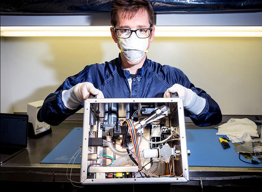 Patrick Degrosse, engineer at JPL, shows the guts of a ventilator