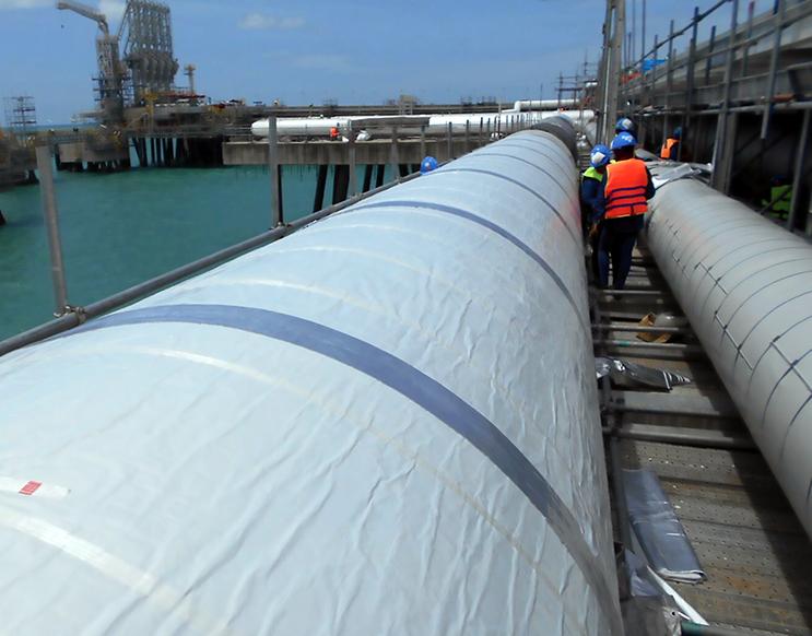 These liquid natural gas line in Thailand are insulated with a NASA spinoff aerogel material. Credit: Aspen Aerogels Insulated liquid natural gas pipelines
