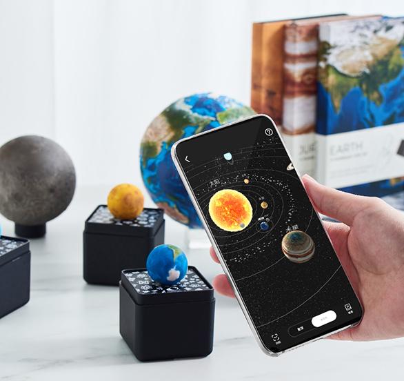 Using augmented reality technology, AstroReality’s Solar System Mini set can pair with the mobile app to give users an immersive learning experience that includes a view of the solar system from the vantage point of each planet. Credit: AstroReality AstroReality’s Solar System Mini set and mobile app