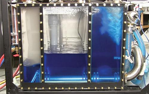 This demonstration of the Chilldyne cooling system pumps coolant from three chambers into adjacent servers. Changes in pressure between the chambers cause fluids to flow through the loop. Credit: Flometrics The Chilldyne cooling system