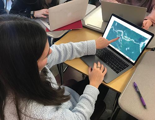 A ninth grader at Weston High School in Weston, Massachusetts, scours satellite imagery to locate illegal gold mines in the Yanomami protected territory of the Amazon rainforest in Brazil. Founded by former NASA officials, Earthrise Alliance is helping students engage with emerging environmental stories through Earth-observation data. Credit: Earthrise Education A ninth grader scours satellite imagery